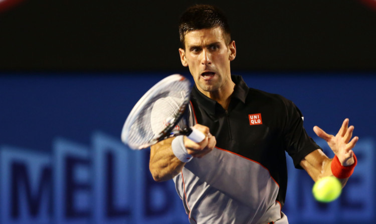 Novak Djokovic plays a forehand in his third round match against Denis Istomin.