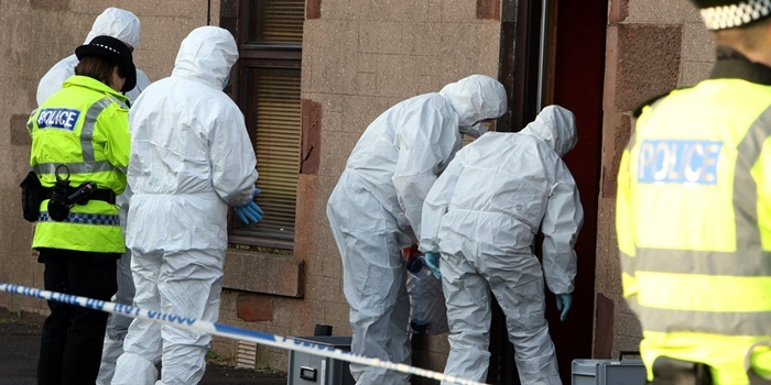 John Stevenson. Courier. 11/12/11. Angus, Carnoustie.All pics show police activity in the incident in the Kinloch Street, Brown Street, Panmure Street area of the town. Pic shows forensics officers as they enter the cottage in Kinloch Street.