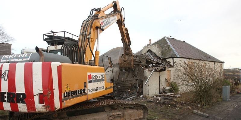 Kris Miller, Courier, 12/12/11. Picture today at Muiredge Cottages, Buckhaven shows the house where Robert Thomson murdered his children. The house was today demolished. Pic shows the demolition work getting started.