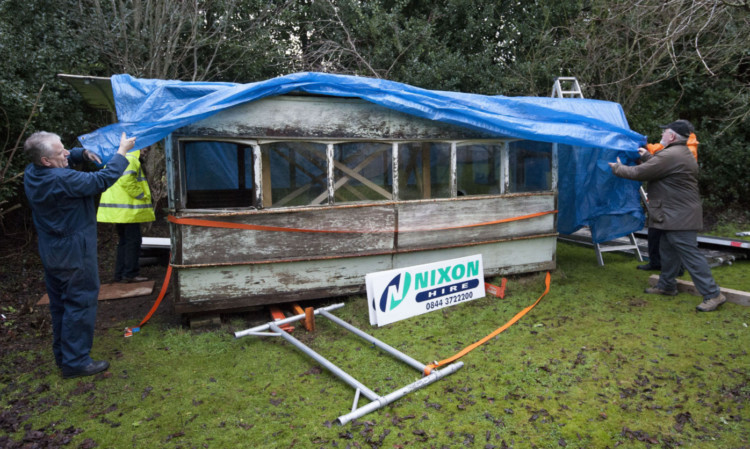 The tramcar is made ready for transport back to Dundee.