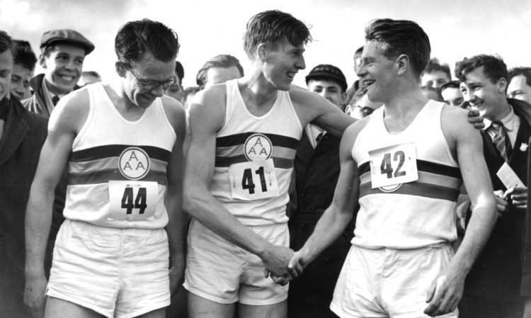 Chris Chataway, right, congratulates Roger Bannister on becoming the first man to break the four-minute mile barrier in 1954. On the left is Chris Brasher, who died in 2003.