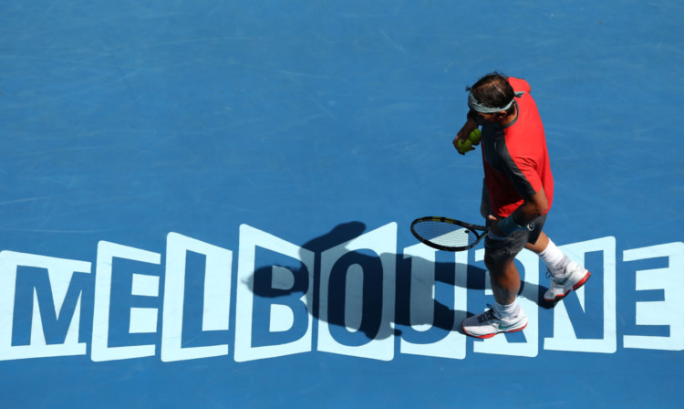 Rafael Nadal prepares to serve in his fourth round match against Kei Nishikori.