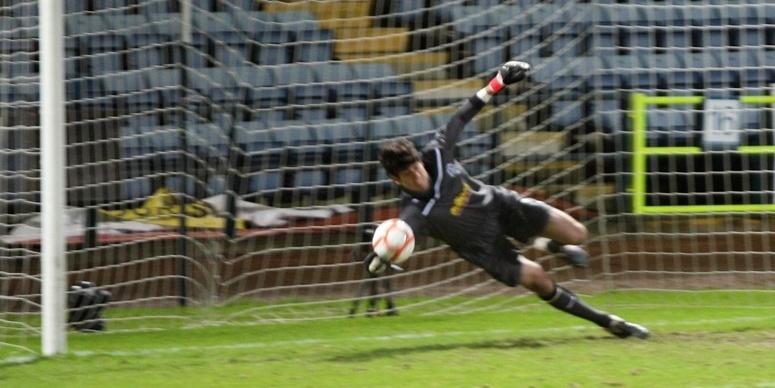 Kris Miller, Courier, 26/12/11. Dundee V Greenock Morton, 2nd half. Morton keeper saves Matt Lockwoods penalty.