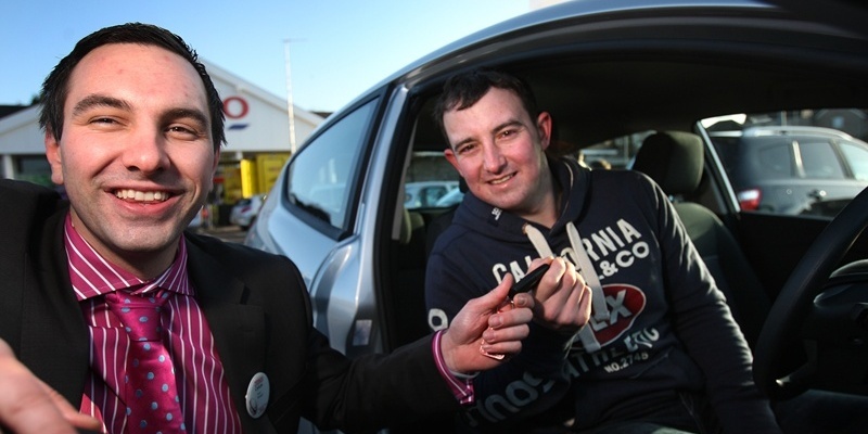 Kris Miller, Courier, 07/01/12. Picture today at Tesco, Forfar where a competition was run to win a Ford Fiesta courtesy of Glenford. Pic shows Gavin Milne from Letham who picked the keys and won the car. Pic is of Gavin recieving the keys from store manager, Calum Telford.