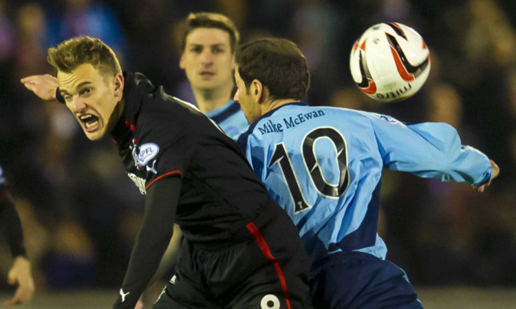 Forfar skipper Gavin Swankie tussles with Gers striker Dean Shiels during Mondays clash.