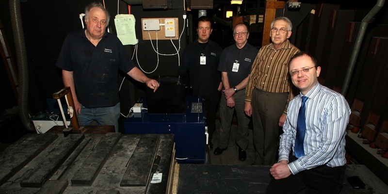 John Stevenson. Courier. 18/01/12. Dundee. The Caird Hall. Contractors replace and install new  humidifier( blue box) inside the Caird Hall Organ. Pic shows l/r David Lovett, Martin Legg and Ged Andrew from Watkins & Watson with Friends of Caird Hall Organ Chairman Jim McKellican and City Organist Stuart Muir.