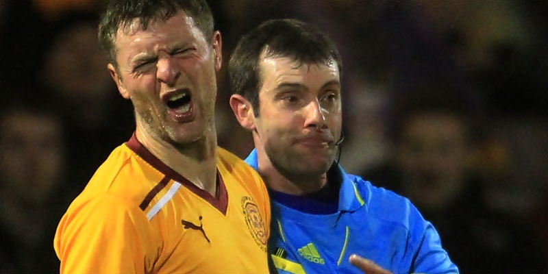 Motherwell's Stephen Craigan (left) is sent off by Referee Alan Muir following an incident with Dunfermline's Andrew Barrowman during the Clydesdale Bank Scottish Premier League match Fir Park, Motherwell.