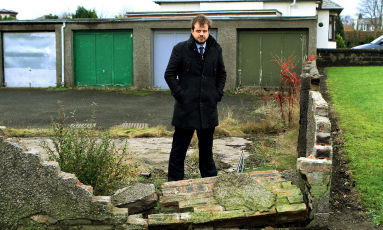 Councillor Craig Melville beside the lock-ups on Anstruther Road.