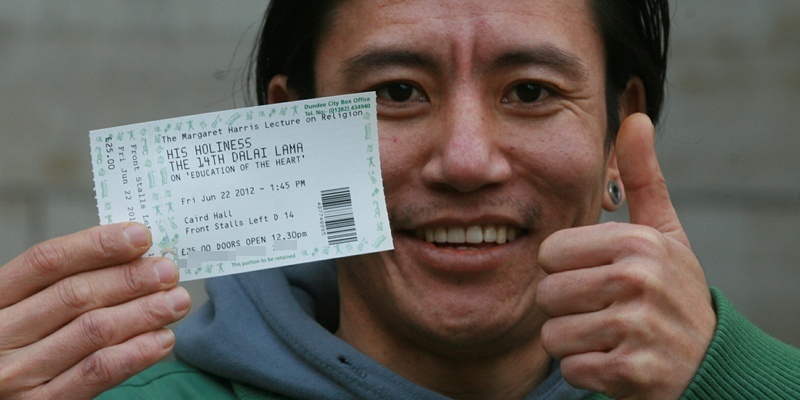 Gareth Jennings , tel ticket queue for in city square Dundee, for Dalai Lama,  Karma Tenthar the only Tibetan in the queue is delighted to get his tickets .