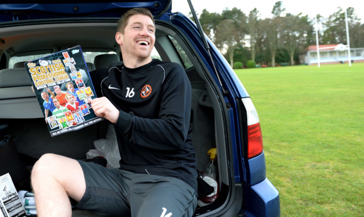 Mark Wilson, who has penned a new deal keeping him at Tannadice until 2015, is all smiles as he helps promote the Topps 2014 SPFL Sticker Album.