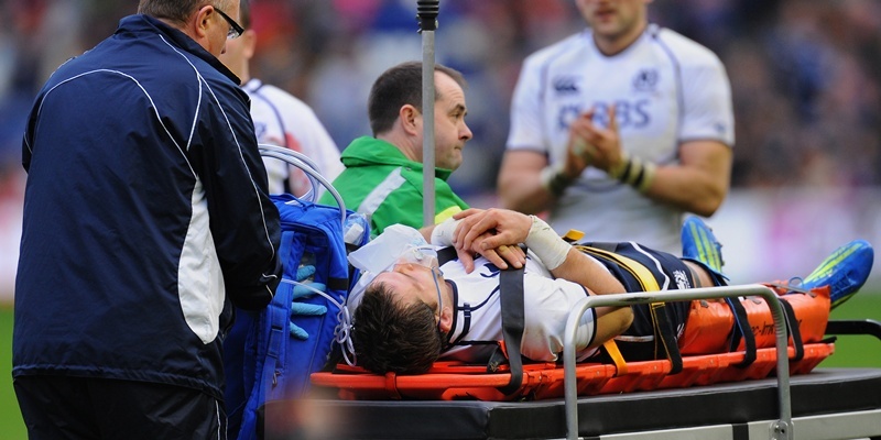 Scotland's Rory Lamont is taken off on a stretcher