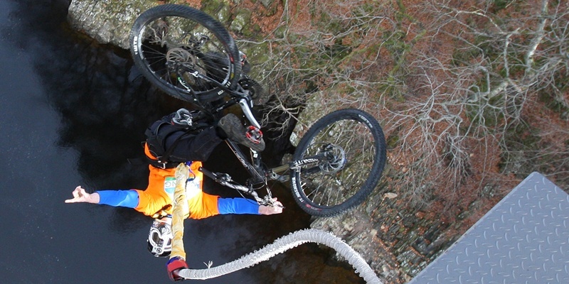 Kris Miller, Courier, 28/02/12. Picture today at Highland Fling Bungee, Killiecrankie where cyclist Adam Flint was taking part in the first 'bike bungee'. Pic shows Adam (doing a front flip) during one of his jumps.