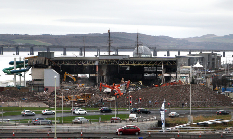 Crews working on the demolition of the former Olympia swimming pool.