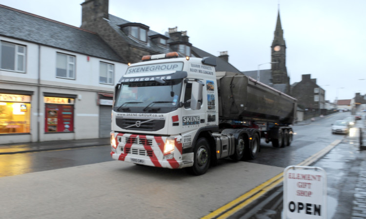 A Skene Group lorry travels through Leslie