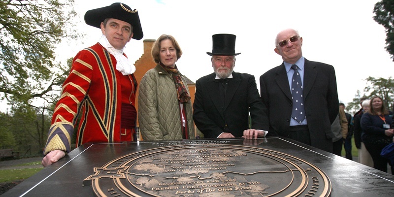 Kris Miller, Courier, 21/04/12. Picture today at Pittencrieff Park (Pittencrieff House Museum) for unveiling of a replica Forbes Marker in memory of General Forbes who was born in Pittencrieff House. Pic shows L/R, Tomm Campbell (correct) as Brigadier General John Forbes, Laura Fisher, Alex Killin (Andrew Carnegie) and Lawrence Keppie (Professor of Roman History and Architecture at Glasgow University) in front of the marker.