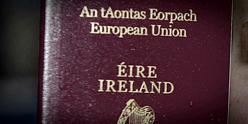 Alanah Jenkins holds her passport after a long queue at the passport office in Dublin.