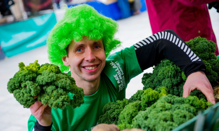 Perth fitness guru Steve Bonthrone examines some of the fresh kale on the Bellfield Farms stall.