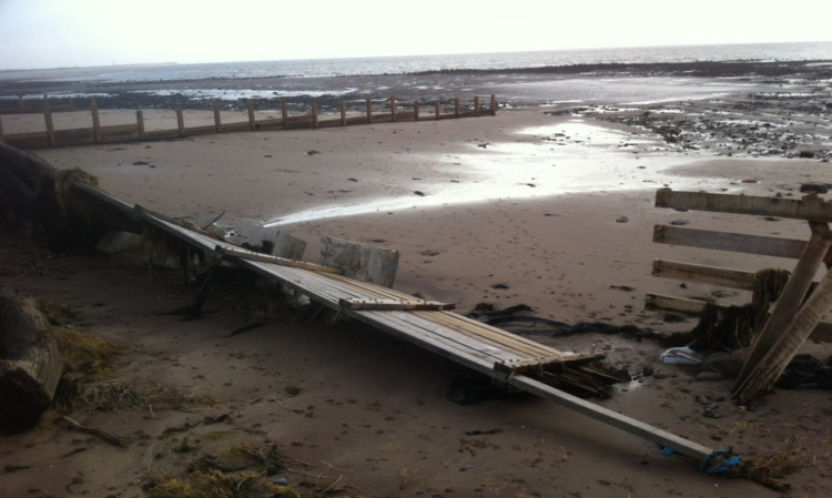 The battered and broken flood defences.