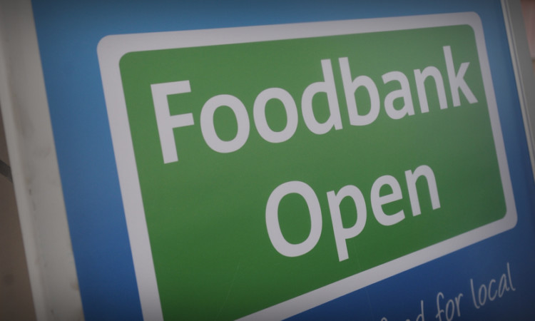 Kim Cessford - 30.11.13 - pictured at the Montrose Tesco store where volunteers with the Angus Foodbank were collecting donations from members of the public - foodbank sign