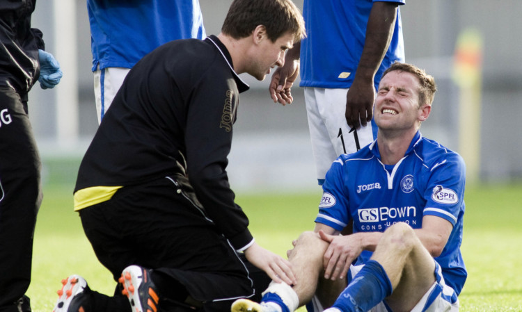 Steven MacLean injures his knee against St Mirren.