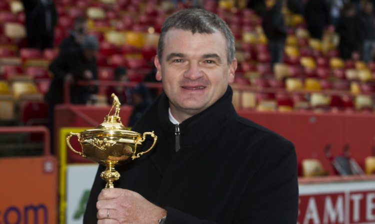 Paul Lawrie parades the Ryder Cup around Pittodrie, home of his beloved Aberdeen FC.
