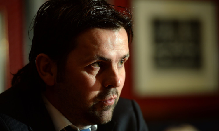 Paul Hartley faces the media at Dens on Tuesday evening.