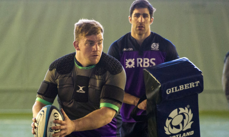 Left behind: dropped Scotland captain Kelly Brown follows prop Moray Low at Scotland training yesterday.