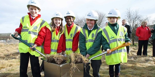 Kim Cessford, Courier - 24.02.11 - pupils from Burnside and Woodlands Primary School's in Carnoustie planted a time capsule at the site of the former Kinloch Primary School at which the £9M Carnoustie Care Project is to be sited - l to r - Kevin Shand, Dana Gray and Grace Roach (Burnside), Andrew Foggie and Annie Nicol (Woodlands)