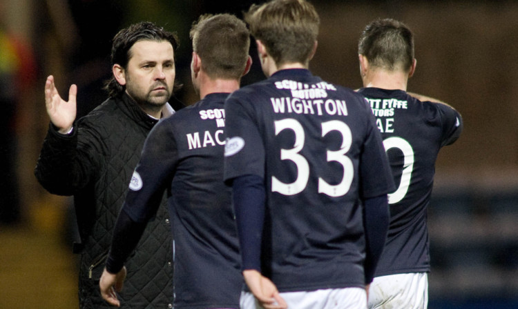 Paul Hartley shows his support for his players at full-time.
