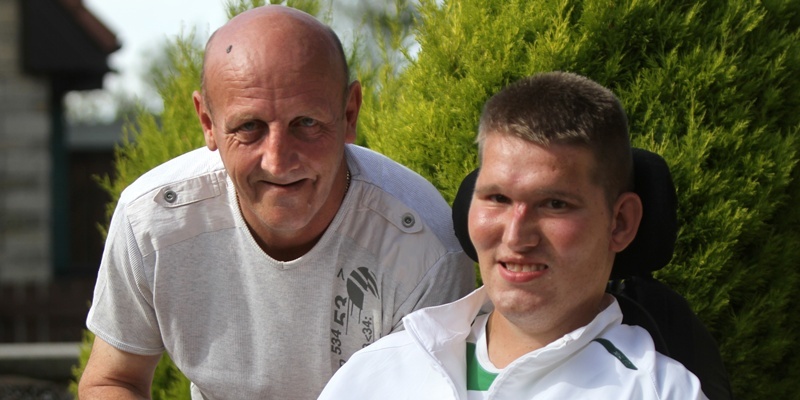 Kris Miller, Courier, 29/08/12. Picture today at the home of Norman and Daniel Mathieson, McGregors Walk, Arbroath. Pic shows Norman and Daniel with a cheque for £50 which was donated after a Forfar woman read about the appeal to raise money for a once in a lifetime holiday for Daniel.