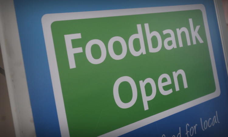 Kim Cessford - 30.11.13 - pictured at the Montrose Tesco store where volunteers with the Angus Foodbank were collecting donations from members of the public - foodbank sign