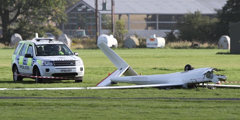 Kris Miller, Courier, 04/09/12. Picture today at Portmoak Airfield/Scottish Gliding Centre where a glider was involved in a fatal accident. Pic shows glider lying on airfield with police presence.