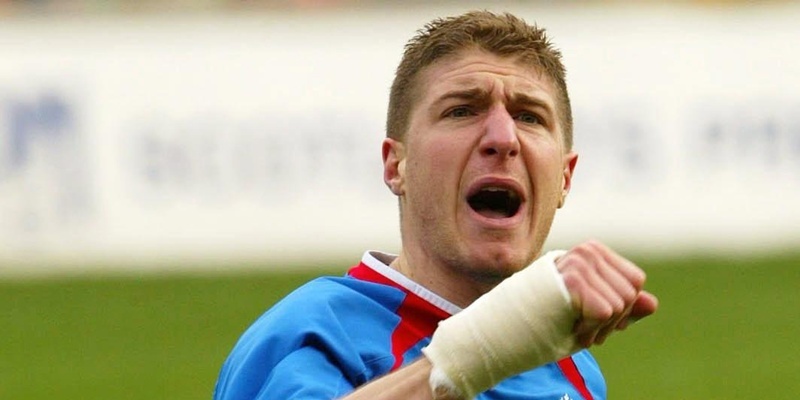 Rangers' Gregory Vignal celebrates scoring the opening goal.