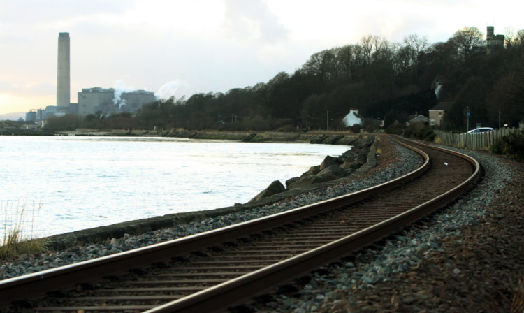 The railway line next to the Forth at Culross, with Longannet Power Station in the distance.