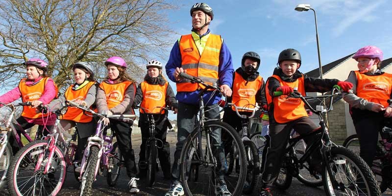 Scottish Cycling legend Graeme Obree is pictured with children from Longstone Primary School in Edinburgh to launch the new cycling proficiency training, Bikeability Scotland.