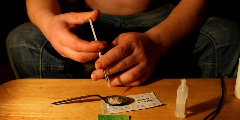 An addict takes heroin in the town of Portlaoise, Co Laois, where outreach workers believe up to 600 users could be taking heroin behind closed doors.