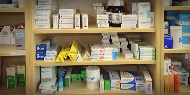 Medicines and drugs on a shelf in a pharmacy.