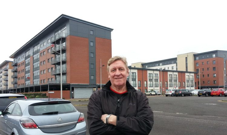 Thomas Cargill outside the townhouses where he lives at Merchants Quay.