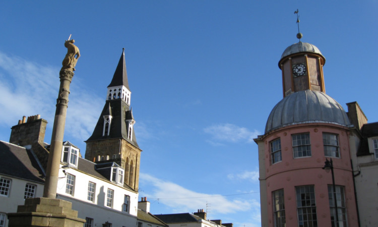 The unicorn atop the Mercat Cross looks out from its new vantage point.