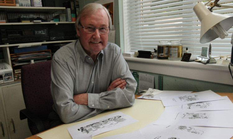 Mr Bell at his drawing table.