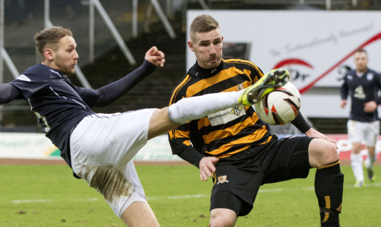 Martin Boyle in action against Alloas Daryll Meggatt.