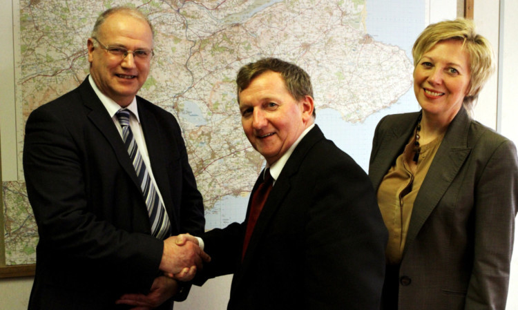 Mr Rowley (centre) bids farewell to Mr Ross and Lesley Laird at Fife House.