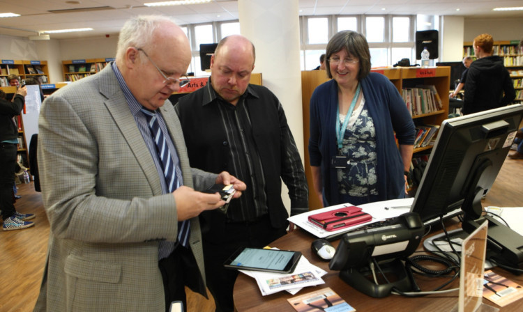 At the launch of the new music download service yesterday, from left: lifelong learning convener Bob Band, IT supervisor Darren Ragsdell and library information services manager Morag Kelly.