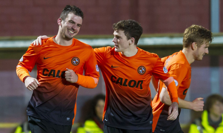 Gavin Gunning (left) is all smiles after bagging his second of the game.