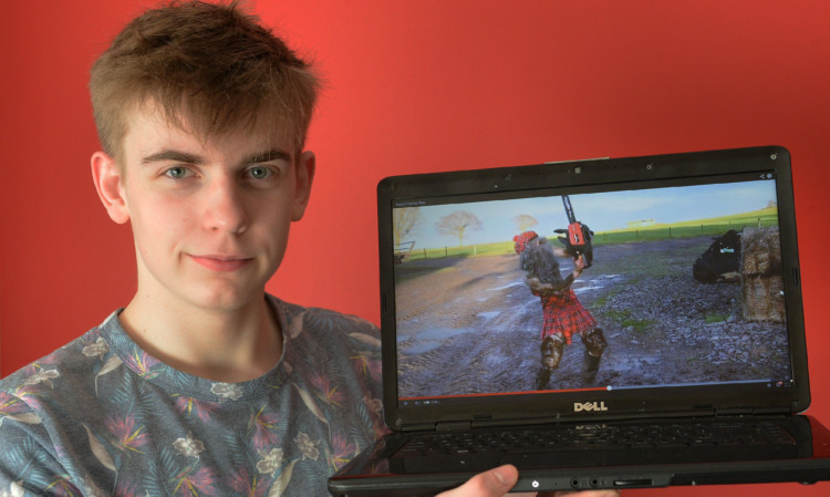 Joseph Hollas shows a clip of how he appeared as Tartan Farmer Boy in the video.