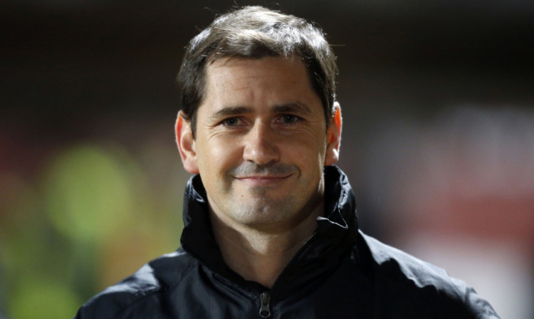 All smiles for Jackie McNamara, who has signed a new deal.