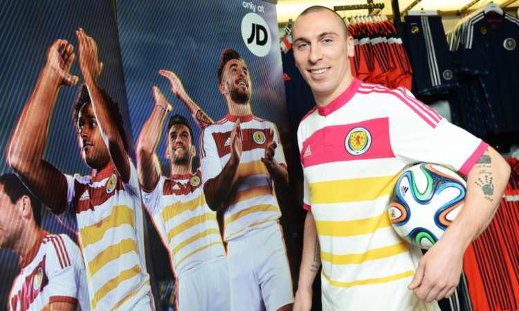 Scotland midfielder Scott Brown helps to launch the national side's new away kit for the UEFA EURO 2016 qualifying campaign.