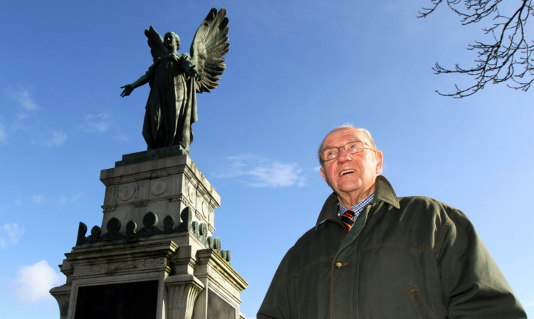 Dave Carstairs beside the war memorial in Cupar, which is to be restored thanks to a grant.