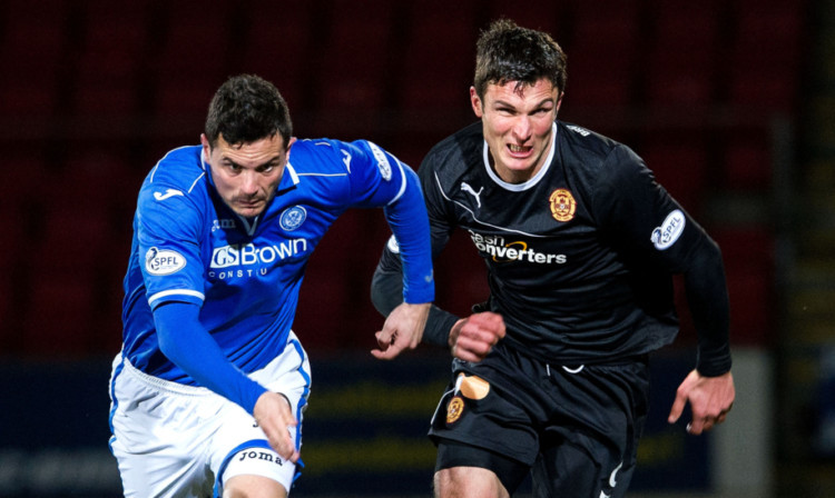 St Johnstone's Gary Miller battles for possession with John Sutton.