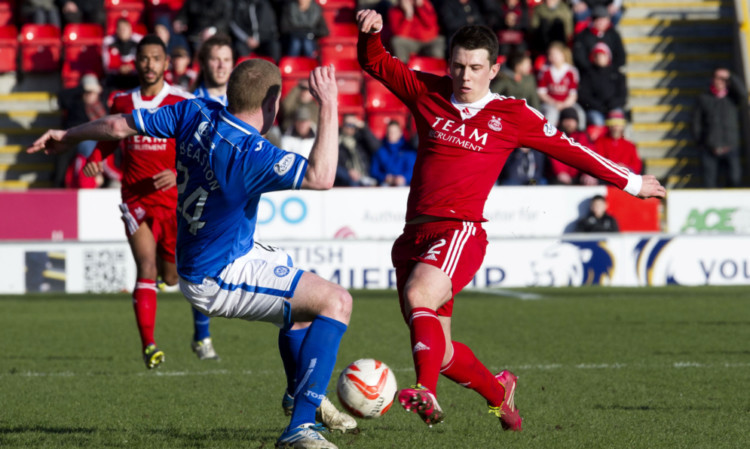 Aberdeen's Ryan Jack challenges for the ball against Brian Easton.